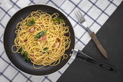 High angle view of noodles in frying pan