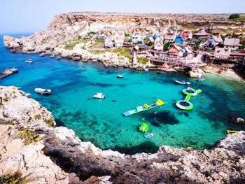 High angle view of boats swimming in sea