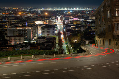 High angle view of illuminated city street at night