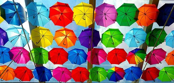 Multi colored umbrellas on paper