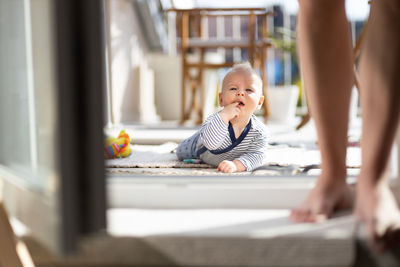 Low section of woman sitting on floor