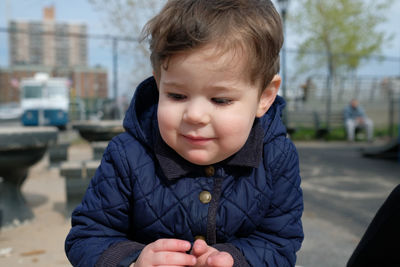 Beautiful boy at a table on the playground