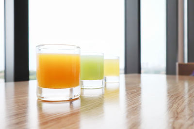 Close-up of orange juice in glass on table