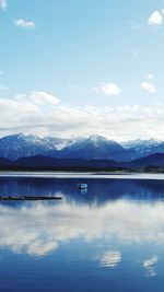 Scenic view of mountains against cloudy sky