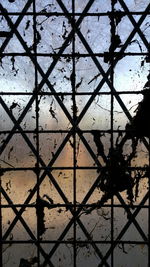 Full frame shot of chainlink fence against sky