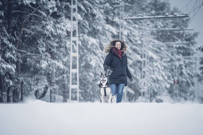 Man standing on snow covered land