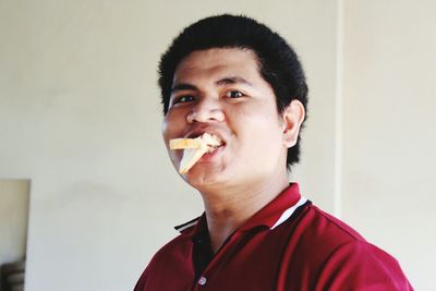 Portrait of boy eating food