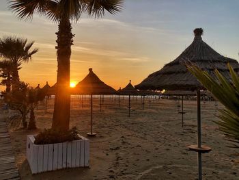 Scenic view of beach against sky during sunset