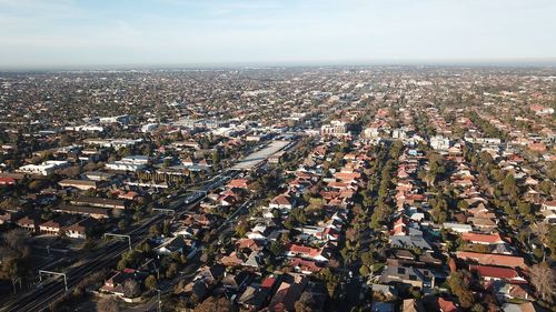High angle view of city buildings against sky