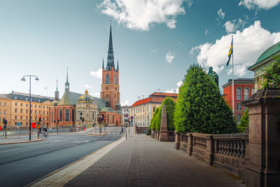 Buildings in city against sky