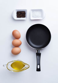 High angle view of breakfast on table against white background