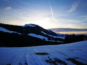 Scenic view of mountains against sky during winter