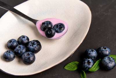 High angle view of fruits in plate on table