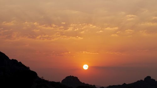 Low angle view of silhouette mountain against sky during sunset