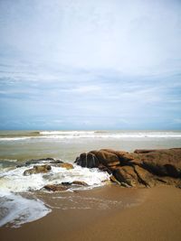 Scenic view of beach against sky
