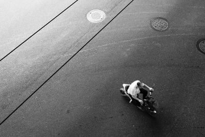 High angle view of two people on street