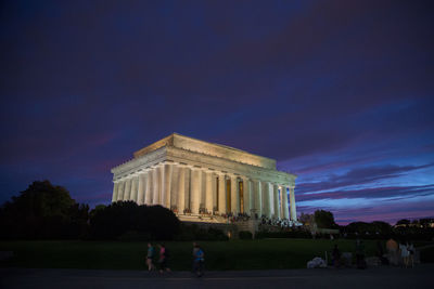 People on street by lincoln memorial at dusk