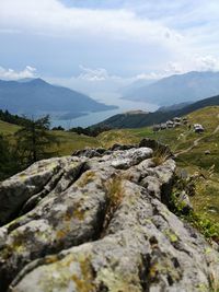 Rocks on landscape against sky