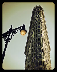 Low angle view of street light against sky