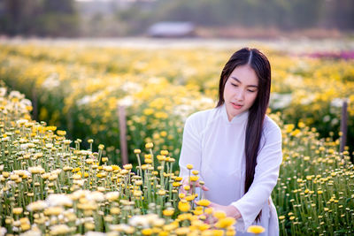 Beautiful woman standing on field