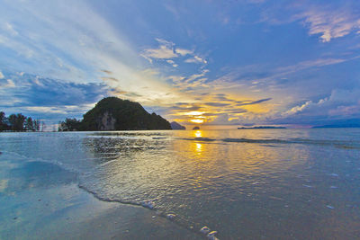 Scenic view of sea against sky at sunset