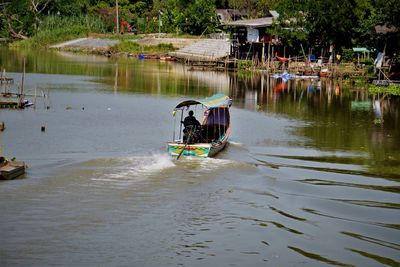 Man sailing in lake