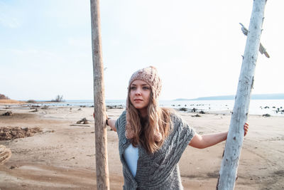 Fashion woman at seashore in autumn