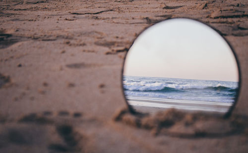 Close-up of sea seen through glass