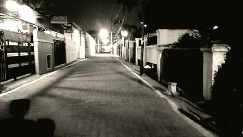 Empty walkway at night