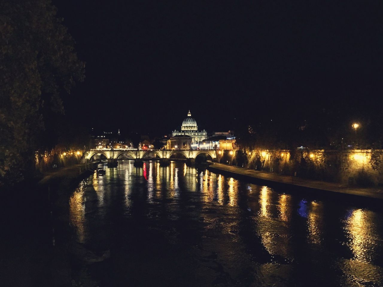 REFLECTION OF ILLUMINATED BUILDINGS IN WATER