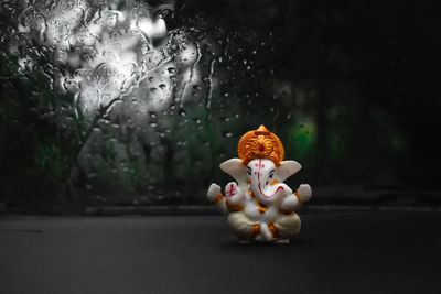 Close-up of toy in glass container