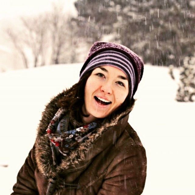 portrait, winter, snow, cold temperature, focus on foreground, looking at camera, front view, warm clothing, close-up, covering, headshot, knit hat, season, animal themes, smiling, outdoors, day, lifestyles