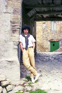 Portrait of young man standing on street