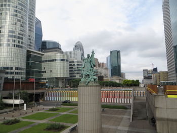 Buildings in city against sky