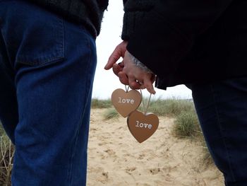 Close-up of hands holding each other