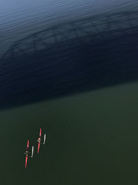 High angle view of airplane flying over lake
