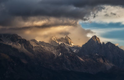 Scenic view of snowcapped mountains against sky