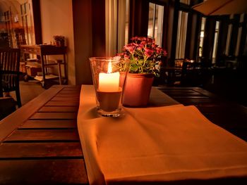 Flower vase on table in restaurant