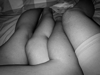 Low section of woman sitting on carpet