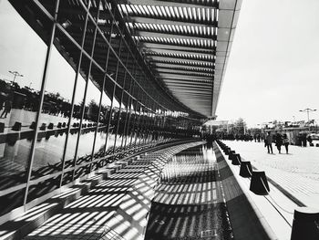 Tilt image of bridge against sky in city