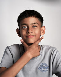 Portrait of young man against white background