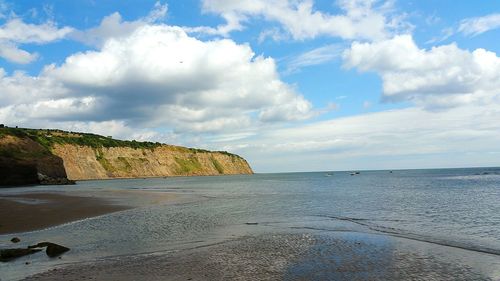 Scenic view of beach against sky