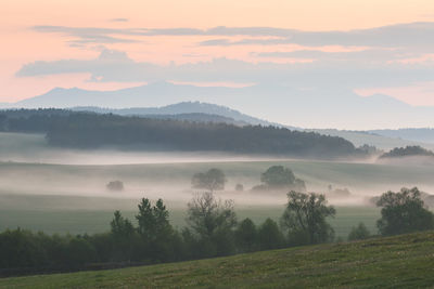 Scenic view of landscape against sky during sunset