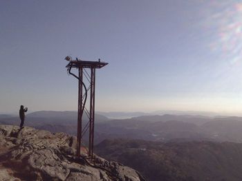 Man on mountain against sky