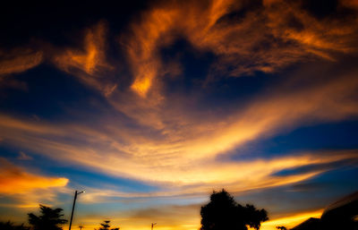 Low angle view of dramatic sky during sunset