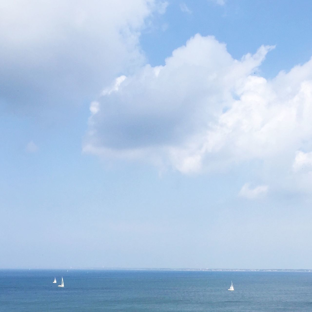 sea, horizon over water, water, waterfront, sky, tranquil scene, scenics, tranquility, beauty in nature, nautical vessel, nature, blue, seascape, transportation, idyllic, cloud - sky, mode of transport, boat, ocean, day