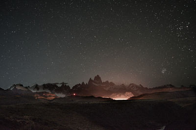 Scenic view of landscape against sky at night