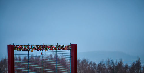 Scenic view of blue sky seen through fence