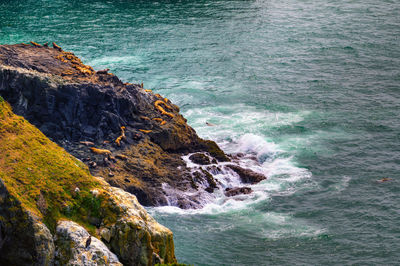 High angle view of rocks on sea