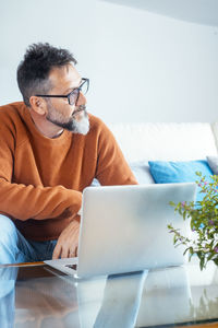 Young woman using laptop at home